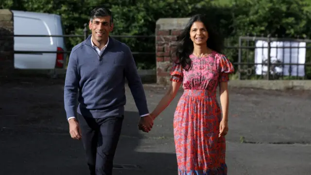 Rishi Sunak and his wife outside a polling station