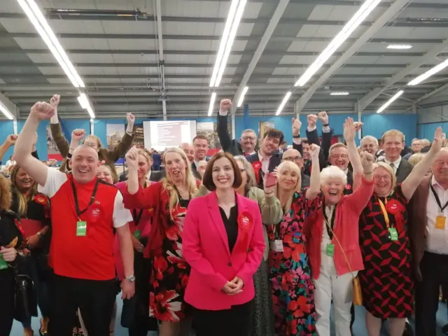 Bridget Phillipson and her team holding their hands in the air and cheering after she won the Houghton & Sunderland South seat