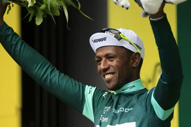 Biniam Girmay smiles while wearing the green jersey after stage five of the 2024 Tour de France