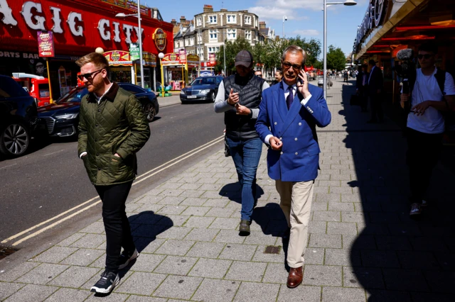 Nigel Farage is seen walking on a street in north-east Essex