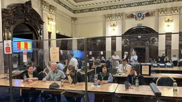 Volunteers at the Guildhall in Hull wait for the ballot boxes to arrive