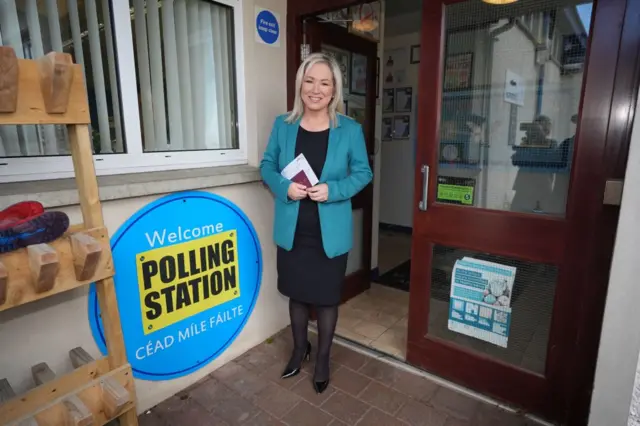 Michelle O'Neill standing at a polling station