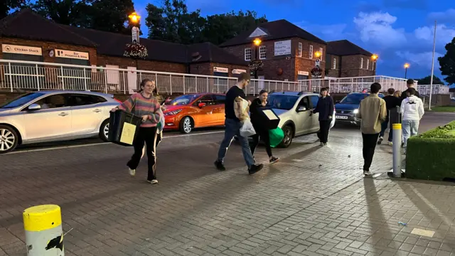 Woman carrying ballot box