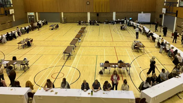 People sat around tables at the count in Darlington