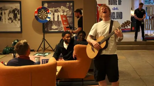 Musician Ed Sheeran performs for the England squad at Spa & Golf Resort Weimarer Land