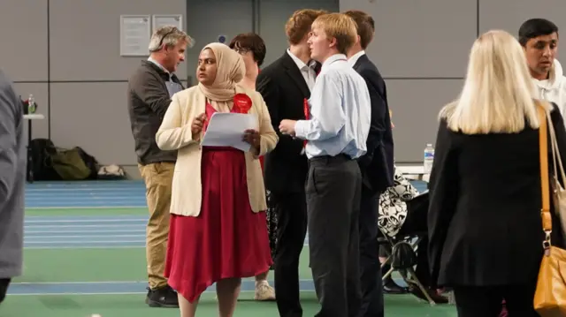 People standing in the counting hall