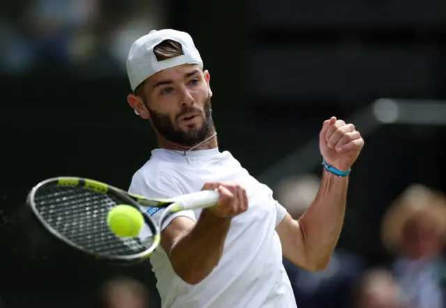 Jacob Fearnley hits a forehand shot