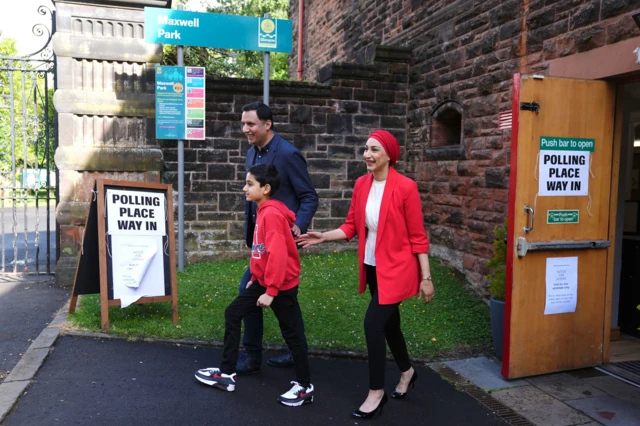 Scottish Labour leader Anas Sarwar with his wife Furheen, and son Aliyan, leave after casting their vote in the 2024 General Election at Pollokshields Burgh Halls in Glasgow.