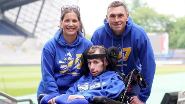 Rob Burrow (centre) with his wife Lindsey Burrow and Kevin Sinfield (right)