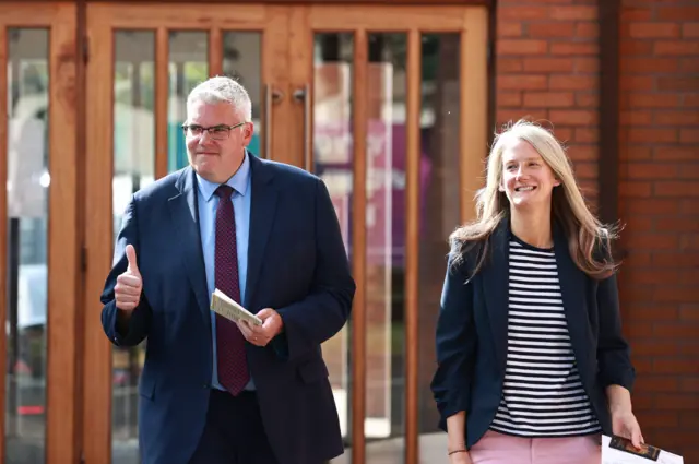 Gavin Robinson pictured with his wife at the polling station