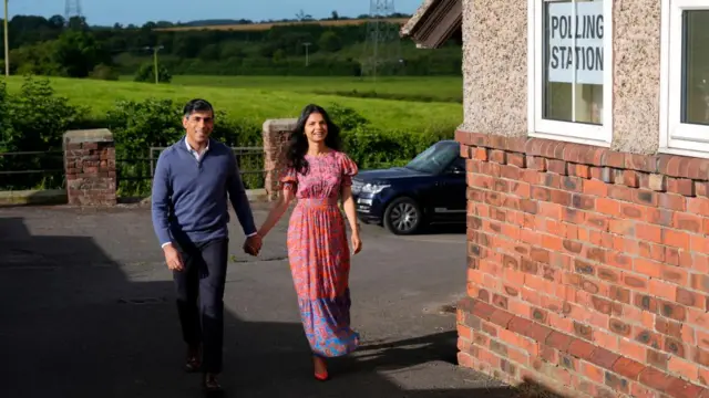 Prime Minister Rishi Sunak and his wife, Akshata Murty arrive to cast their vote