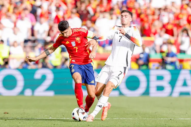 Álvaro Morata of Spain and Kai Havertz of Germany battle for the ball