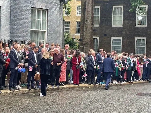 Supporters holding flags in Downing Street