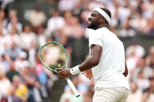 Frances Tiafoe smiles in celebration