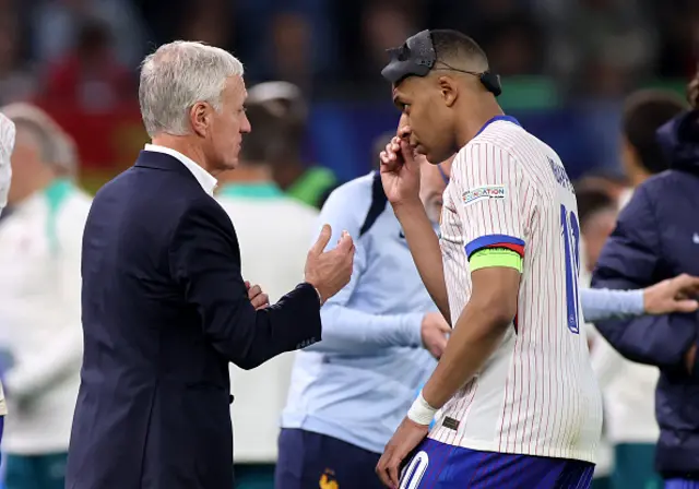 Didier Deschamps, Head Coach of France, interacts with Kylian Mbappe