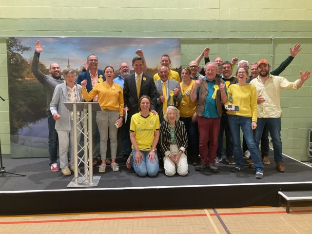 Charlie Maynard celebrates with Lib Dem activists