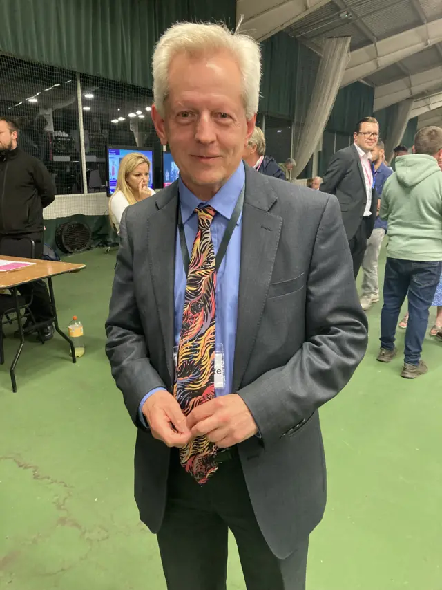 Gloucester Conservative candidate Richard Graham smiling at the camera at the count