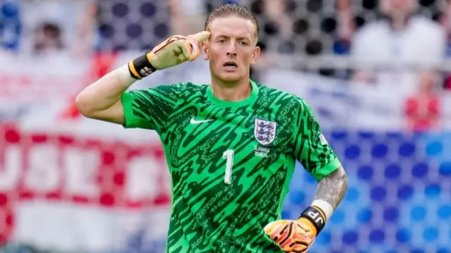 Goalkeeper Jordan Pickford of England gestures during the UEFA EURO 2024 round of 16 match between England and Slovakia at Arena AufSchalke on June 30, 2024 in Gelsenkirchen, Germany.