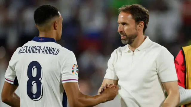 Gareth Southgate, Manager of England greets Trent Alexander-Arnold of England after the UEFA EURO 2024 group stage match between England and Slovenia at Cologne Stadium on June 25, 2024 in Cologne, Germany.