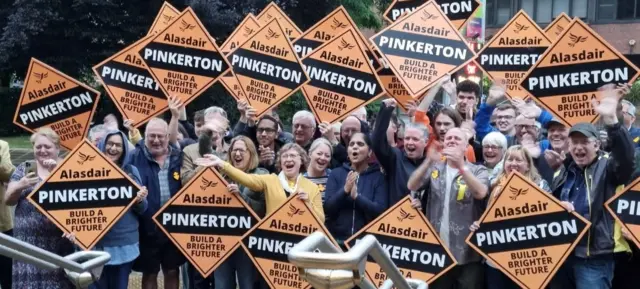 Lib Dem supporters celebrate outside the count