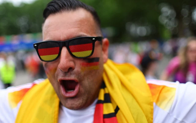 A Germany fan outside the stadium before the match