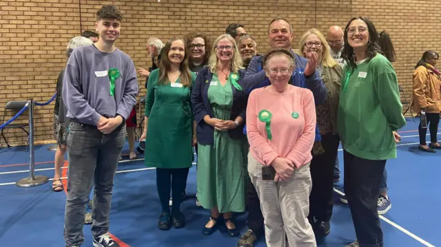 Green party candidate Rachel Cabral, middle, surrounded by rosette-wearing Green Party supporters