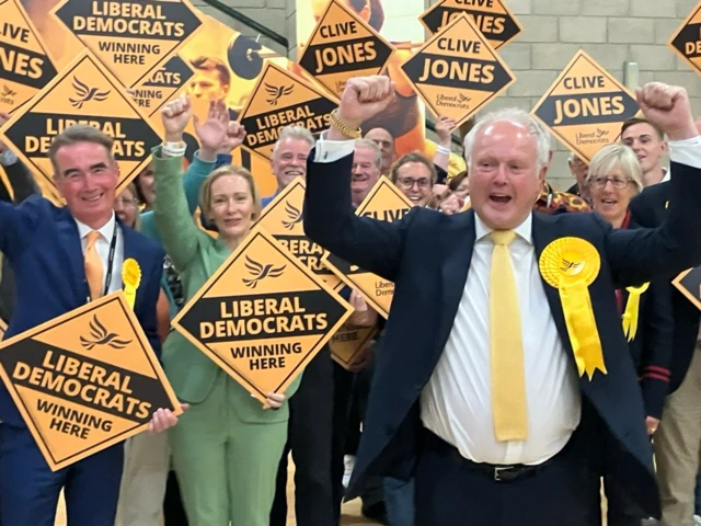 Clive Jones cheering with supporters in the background