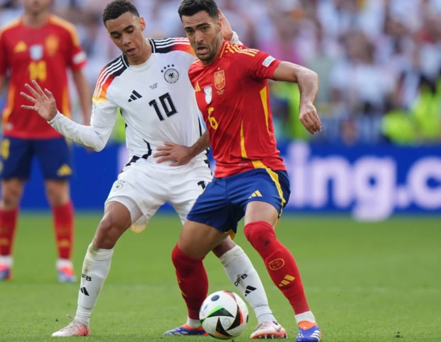 Mikel Merino in action against Germany’s Jamal Musiala