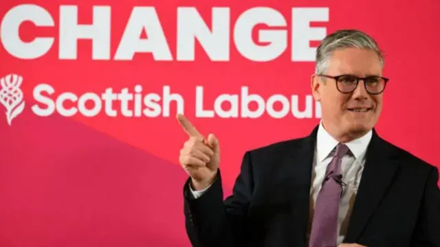 Keir Starmer in front of a red backdrop saying Scottish Labour