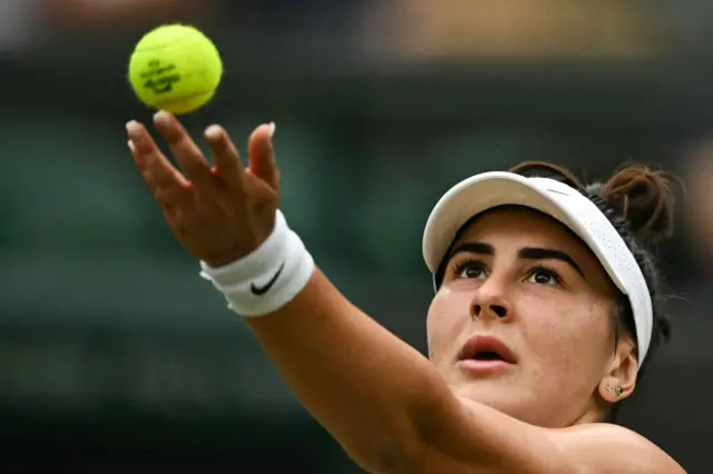 Bianca Andreescu tosses the ball to serve