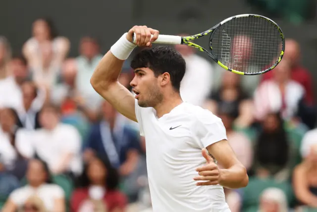 Carlos Alcaraz hits a forehand shot