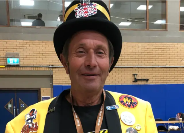 Earl Elvis of East Anglia in yellow jacket and black top hat at South West Norfolk count