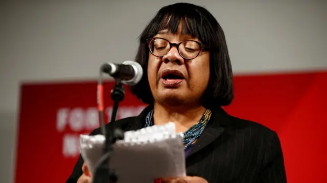 Diane Abbott speaks into a microphone during a campaign event in 2019.