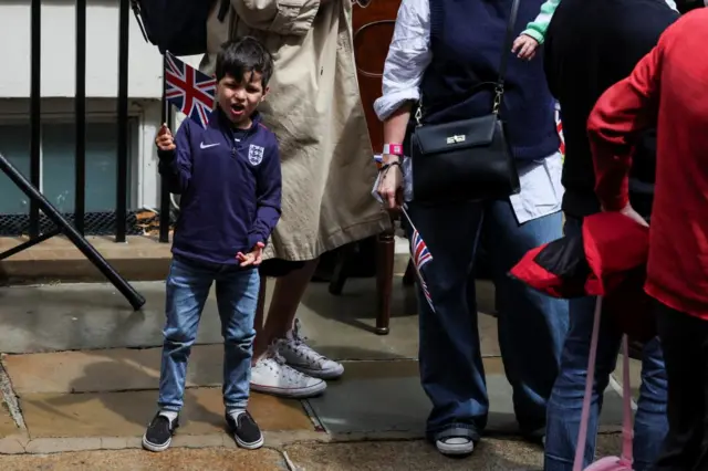 Young supporter  on Downing Street waving a flag