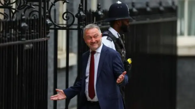 Steve Reed gestures, as he arrives at 10 Downing Street,