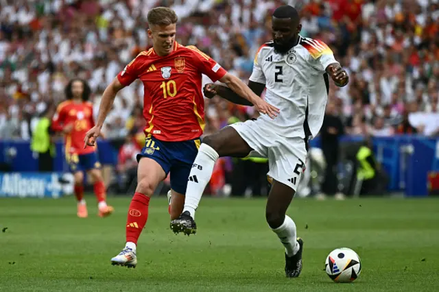 Antonio Ruediger tackles Spain's forward Daniel Olmo