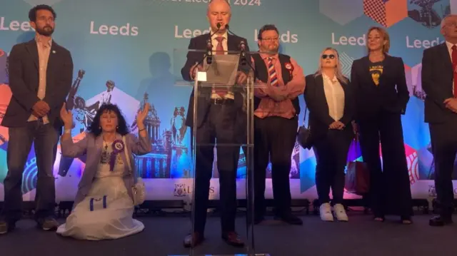 Woman on her knees at count