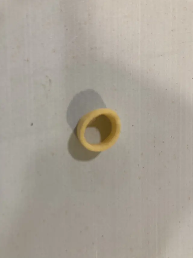 A hula hoop crisp on a laminated table surface