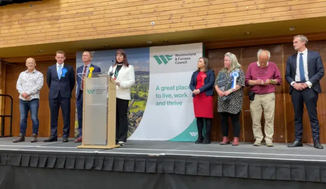 The candidates in Westmorland and Lonsdale seat lined up on a stage as the returning office announces the results