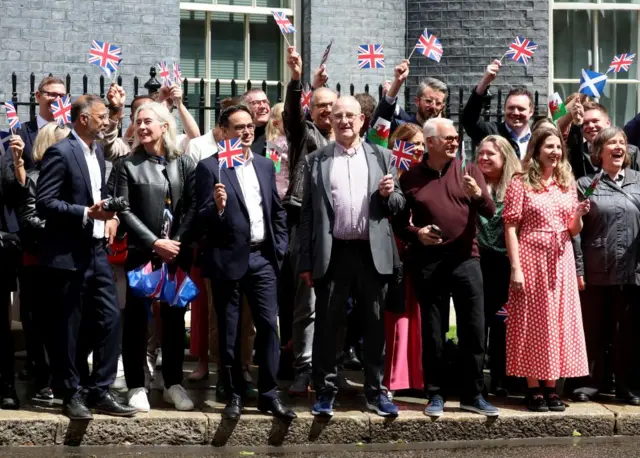 Supporters on Downing Street waving flags