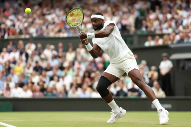 Tiafoe hits a backhand