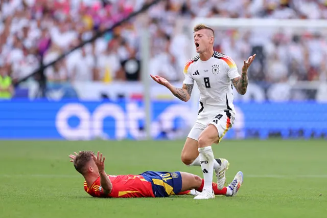 Toni Kroos of Germany reacts after he is adjudged to have fouled Dani Olmo