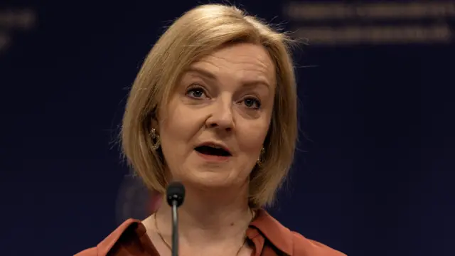 Liz Truss attends a news conference