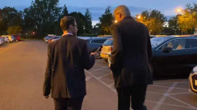 Daniel Kawczynski speaks to Rob Trigg in the car park of Shrewsbury Sports Village