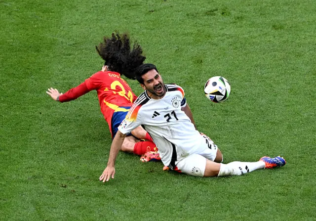 Ilkay Guendogan of Germany reacts after a challenge from Marc Cucurella