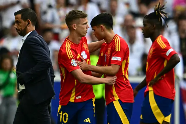 Daniel Olmo gestures to his team midfielder Pedri after he picked up an injury