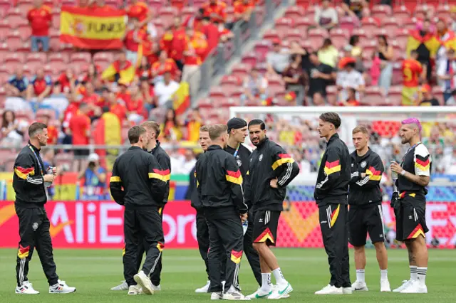 Germany's players inspect the pitch