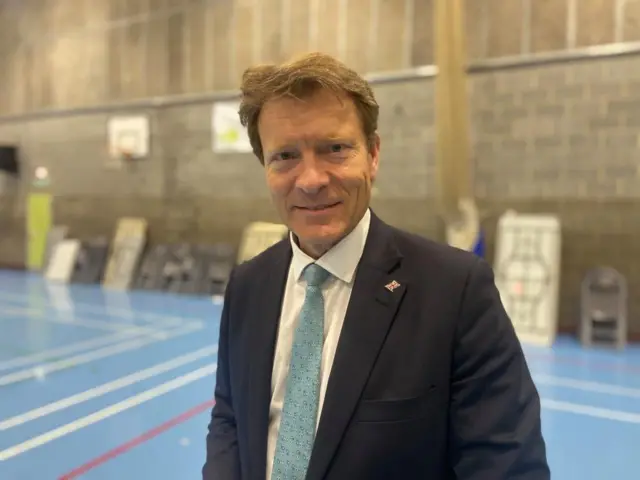 Richard Tice standing in a sports hall