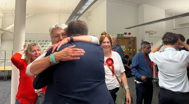 People hugging at count