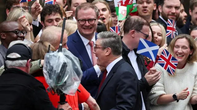 British Prime Minister Keir Starmer reacts as he greets supporters, at Number 10 Downing Street